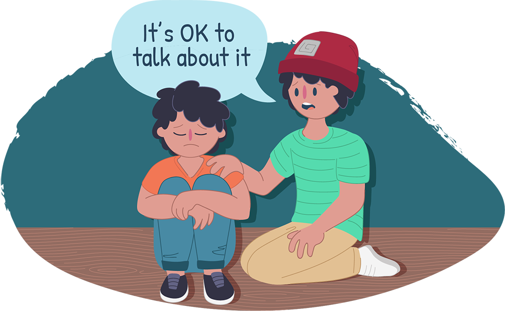 Two boys sitting down together, one looks sad, the other is saying it's ok to talk