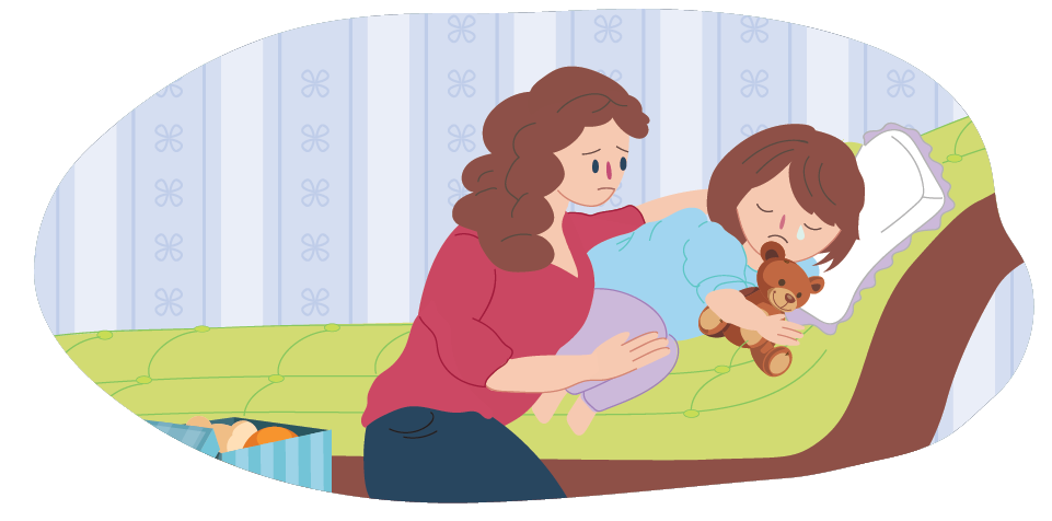 Crying child on bed being comforted by parent